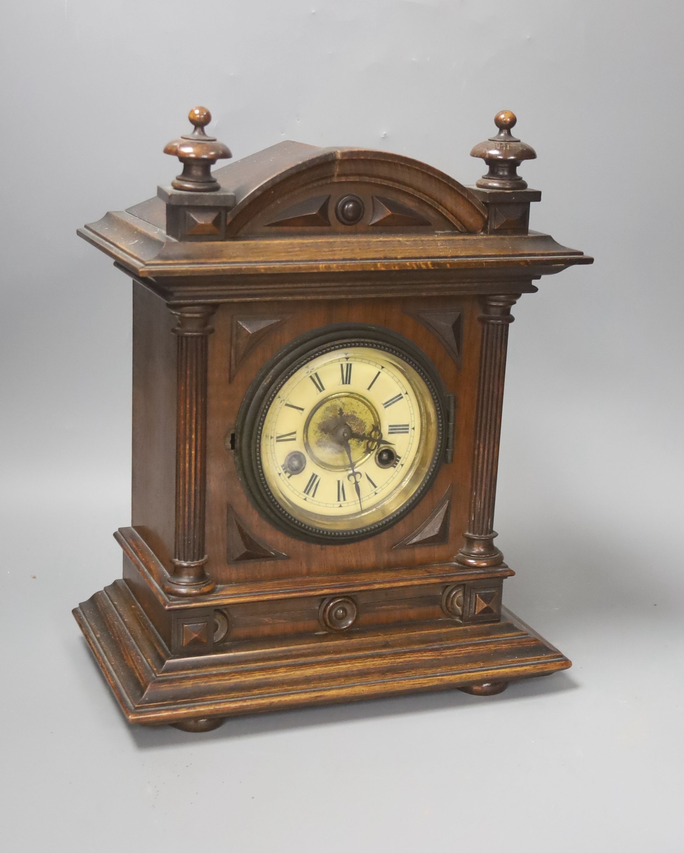 A Late 19th century German walnut mantel clock, 34cm